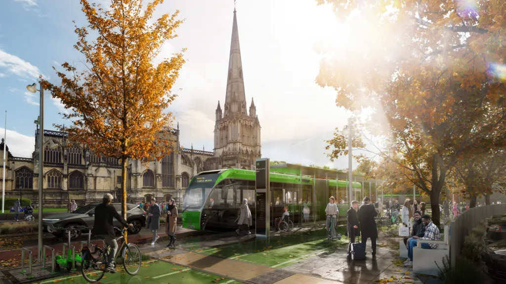 A computer generation of a green tram pulled into a stop near St Mary Redcliffe Church. The church's spire is directly behind the tram. People mill about, some with suitcases, while there is a man on a bike on a green cycle bath.
