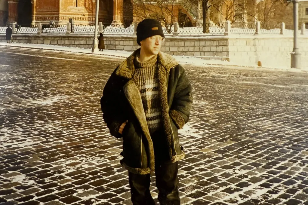 A young Steve Rosenberg is seen wearing a black hat and a thick jacket, in Moscow in 1989/90.