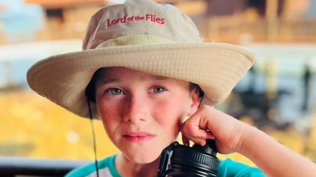 Alfie wearing a Lord of the Flies branded sun hat
