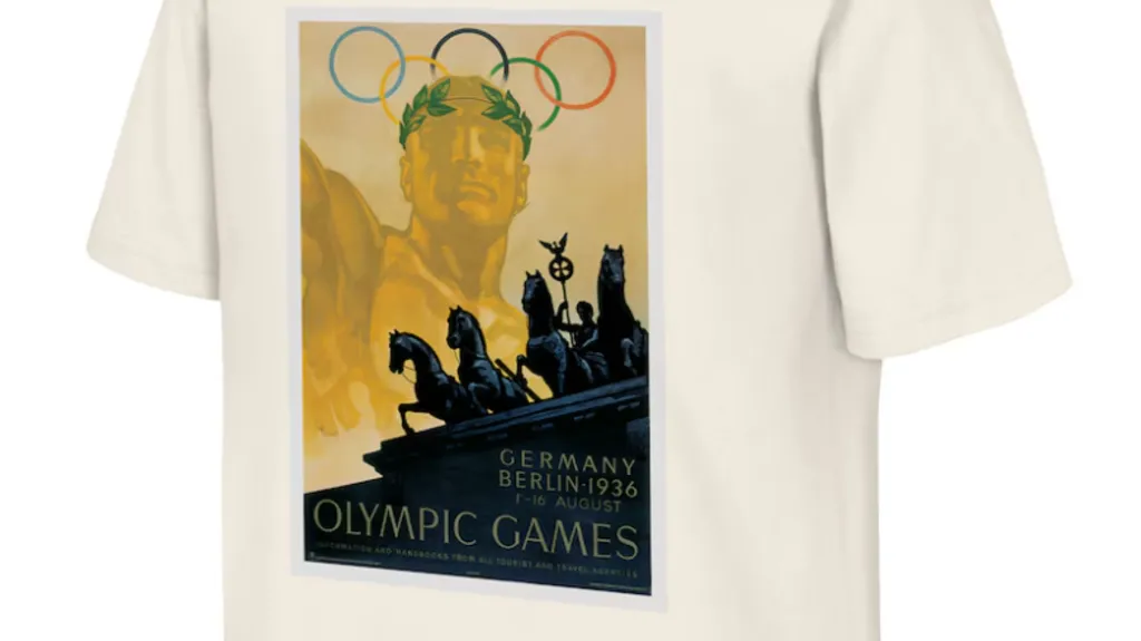 A cream Berlin T-Shirt shows a male figure wearing a laurel wreath. Over his head are the Olympic rings. Underneath him is the Brandenburg Gate and the words "Germany Berlin 1936 Olympic Games".