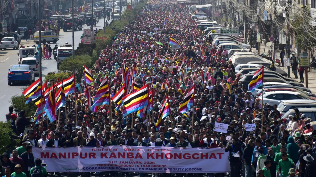 A large gathering in Manipur's capital city Imphal on 31 January 2026, with people waving flags and demanding a resolution of the conflict. 