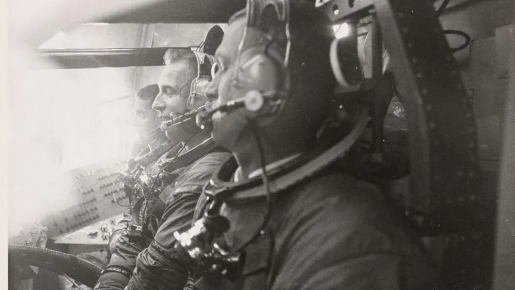 The crew of Apollo 8 in training. They are shown strapped into their seats.