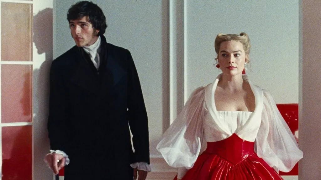 Jacob Elordi in a black suit as Heathcliff and Margot Robbie as Cathy in a white and red PVC dress