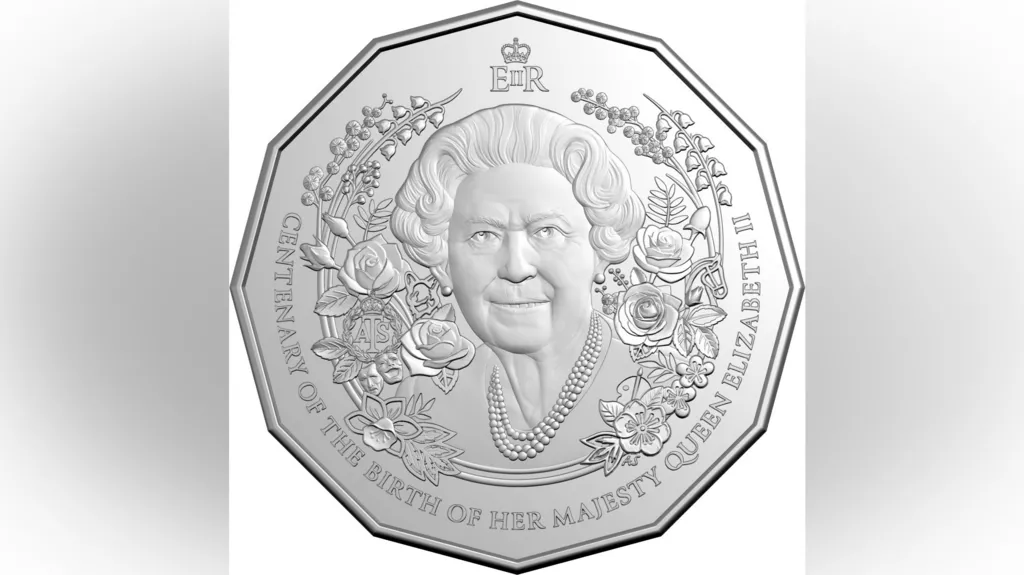A commemorative silver coin featuring a portrait of Queen Elizabeth II