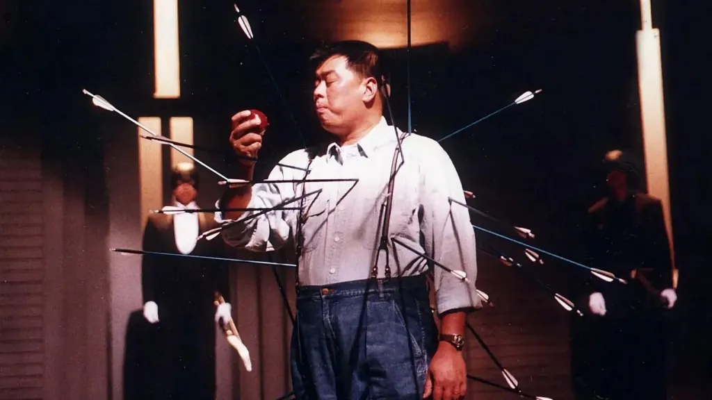 Jimmy Lai bites an apple with a dozen of arrows into his body in a TV ad for the debut of Apple Daily in 1995