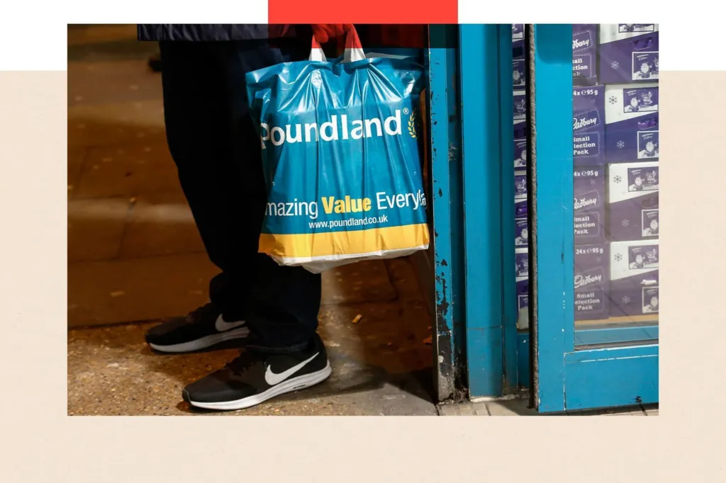 A shopper holds a Poundland shopping bag