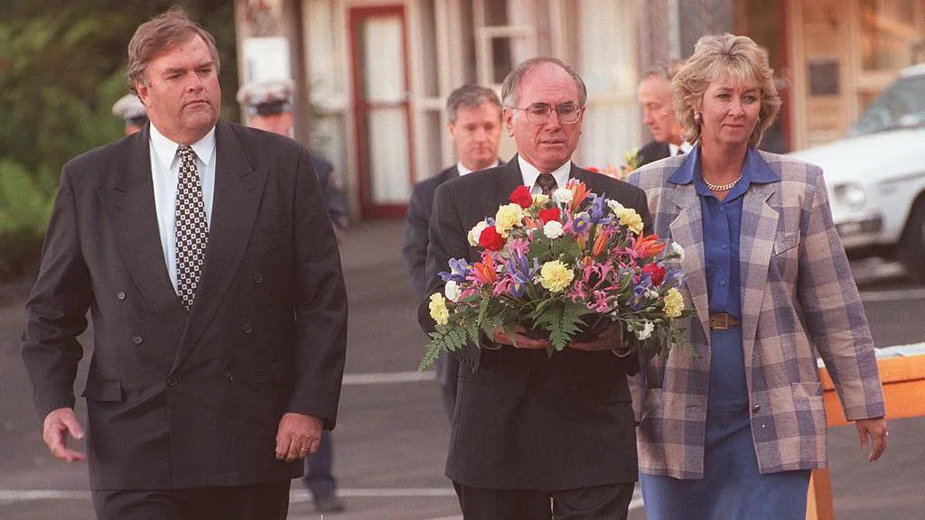 Federal Labor Opposition leader Kim Beazley, Prime Minister John Howard, and Democrats leader Cheryl Kernot at Port Arthur. John Howard is holding a wreath