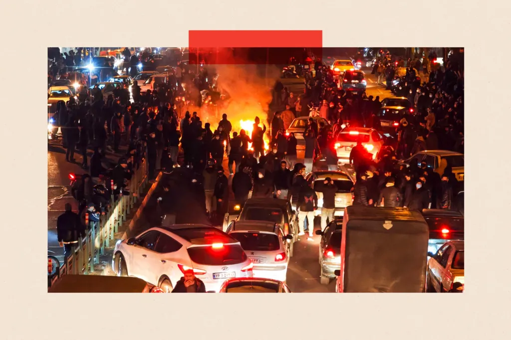 People gather on a road during a protest in Tehran, Iran