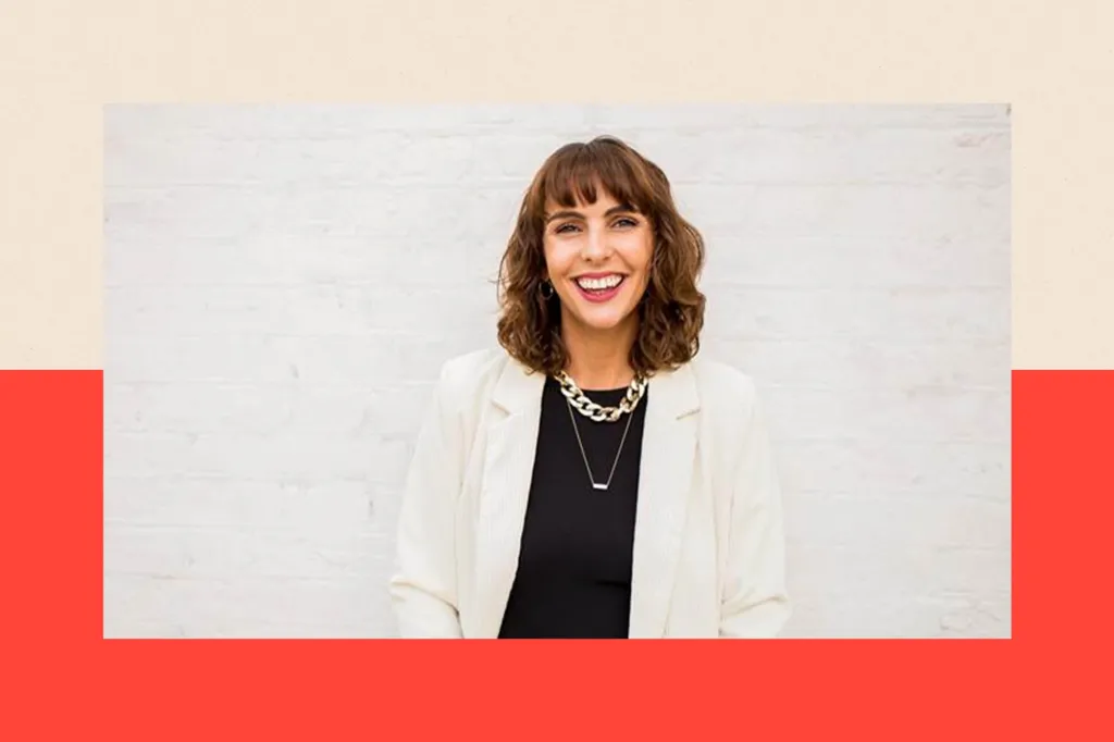 A shot of Vicki Pavitt wearing a white suit with a black top.