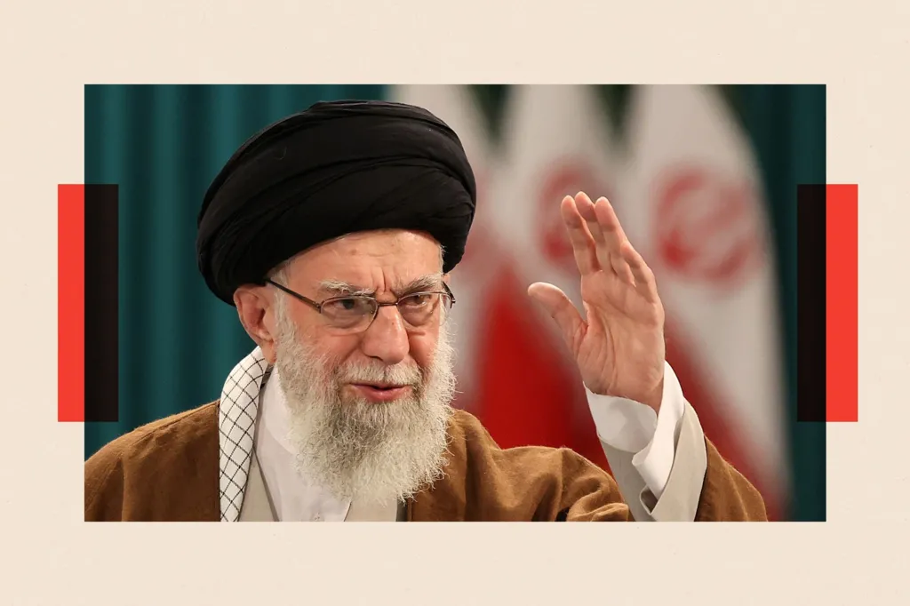 Iran's Supreme Leader Ayatollah Ali Khamenei waves during a press conference 