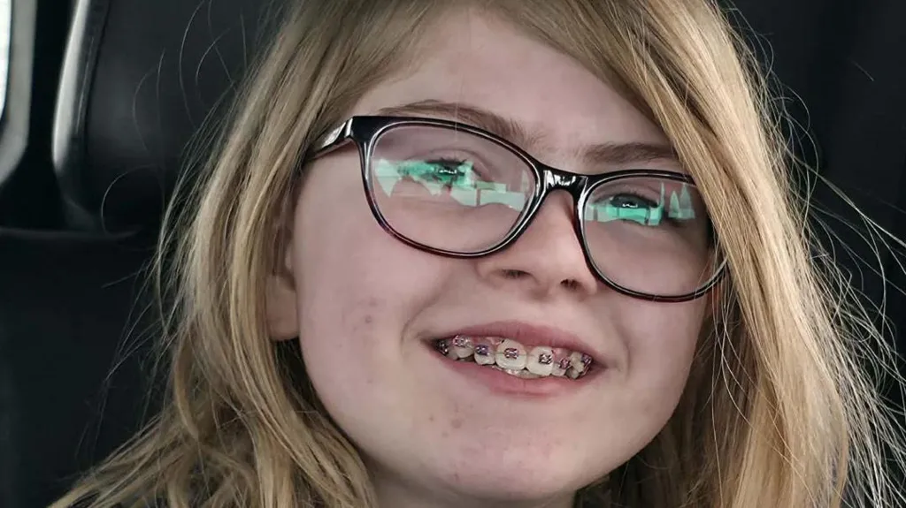 close-up of 12-year-old girl Zoey Benoit, smiling with braces