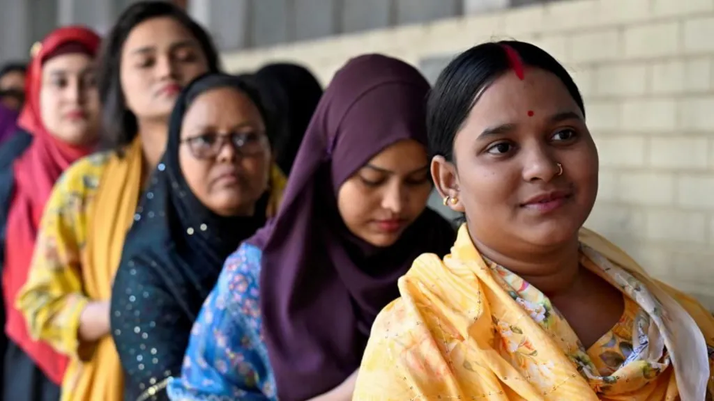 Women stand in a queue to vote outside a polling station during the national election in Dhaka, Bangladesh, February 12, 2026. REUTERS/Fatima Tuj Johora