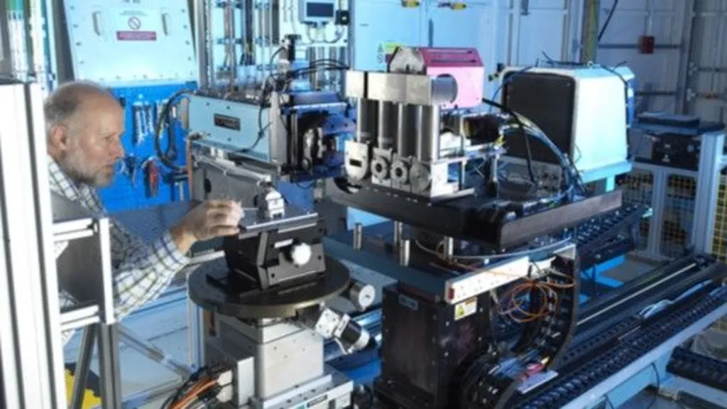 A technician adjusts equipment at Diamond Light Source