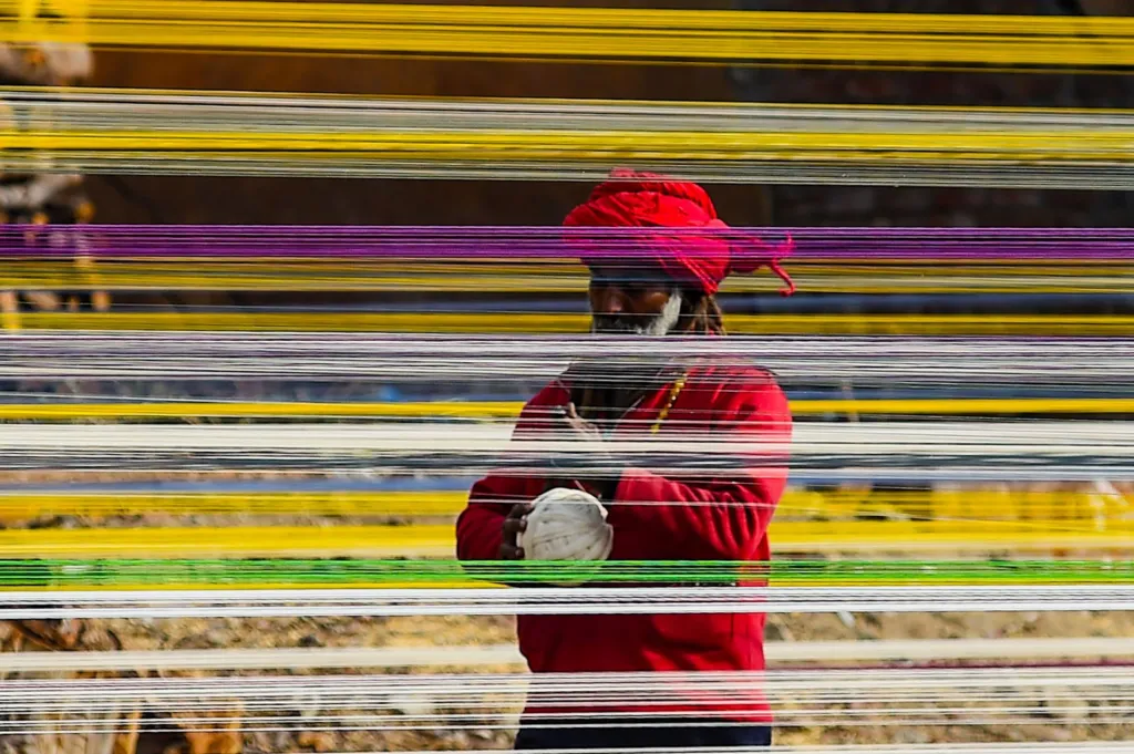 Workers prepare kite-flying thread ahead of the upcoming Basant festival in Lahore, Pakistan, on January 31, 2026. 