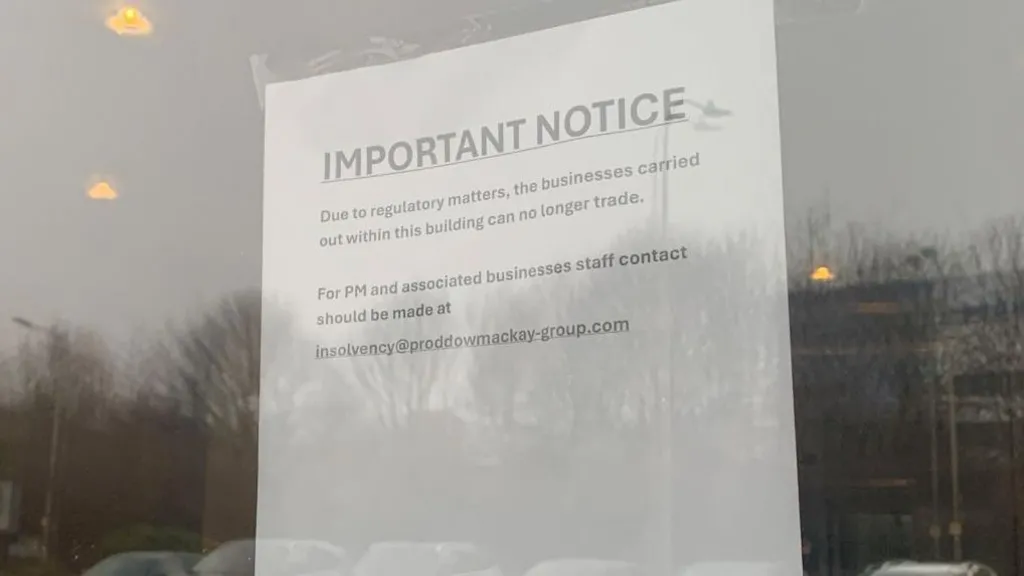A sheet of white paper taped to the inside of a glass door or window. The notice is printed in large text at the top with the heading “IMPORTANT NOTICE”, followed by smaller text explaining that, due to regulatory matters, the businesses operating from the building can no longer trade. The sign also provides an email address for staff from PM Law and associated businesses to contact.