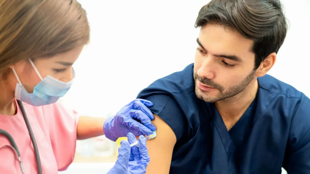 A man being given an injection