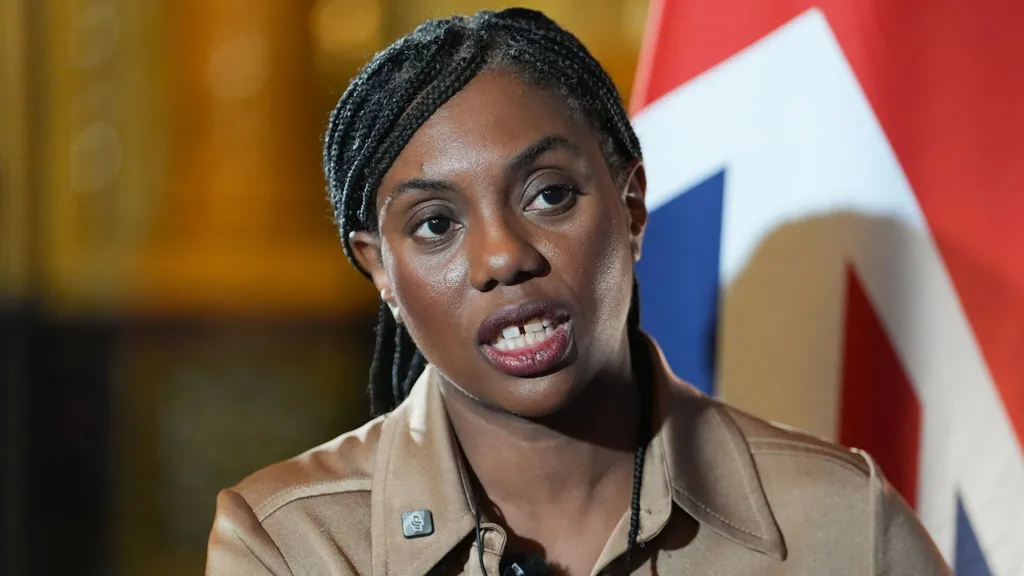Kemi Badenoch looks to the camera while speaking during a press conference with the Union flag in the background, in London on 5 February.