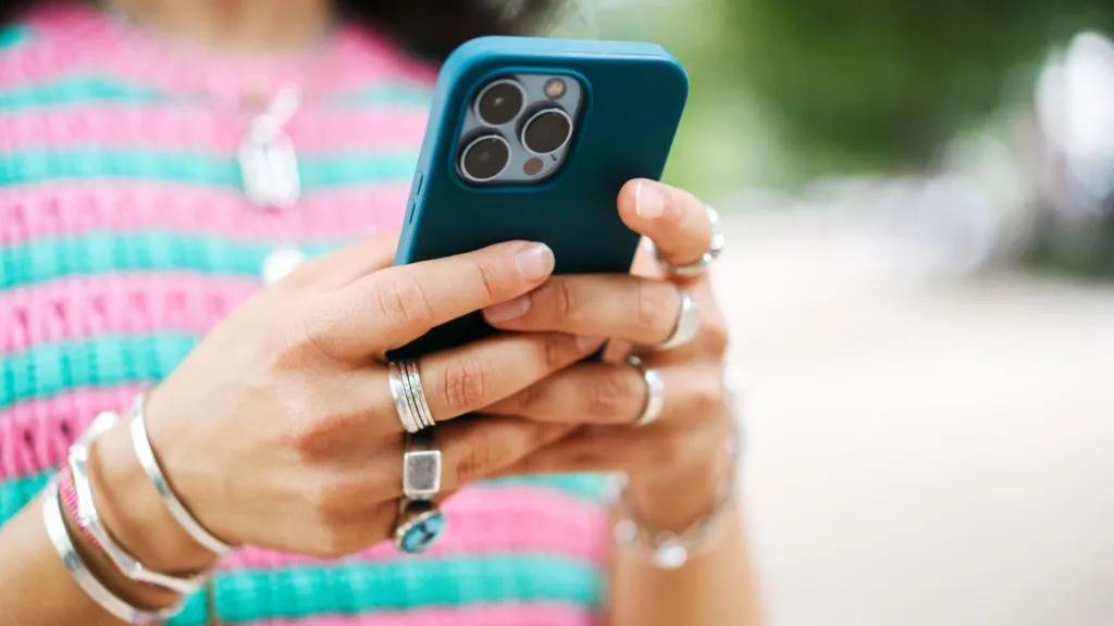 A close-up of a woman using a smartphone