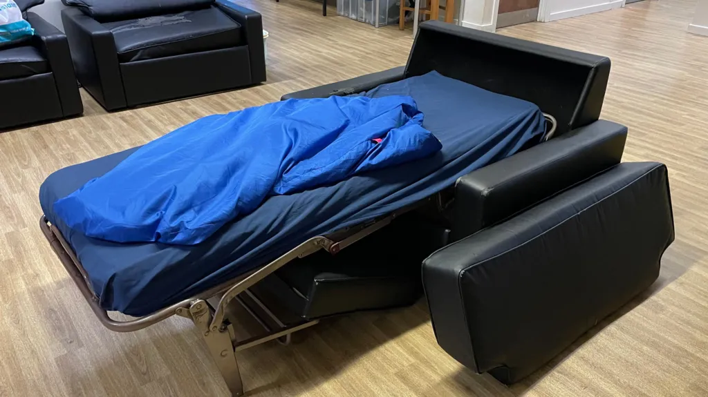 A sofa bed has been laid out at Safe Space