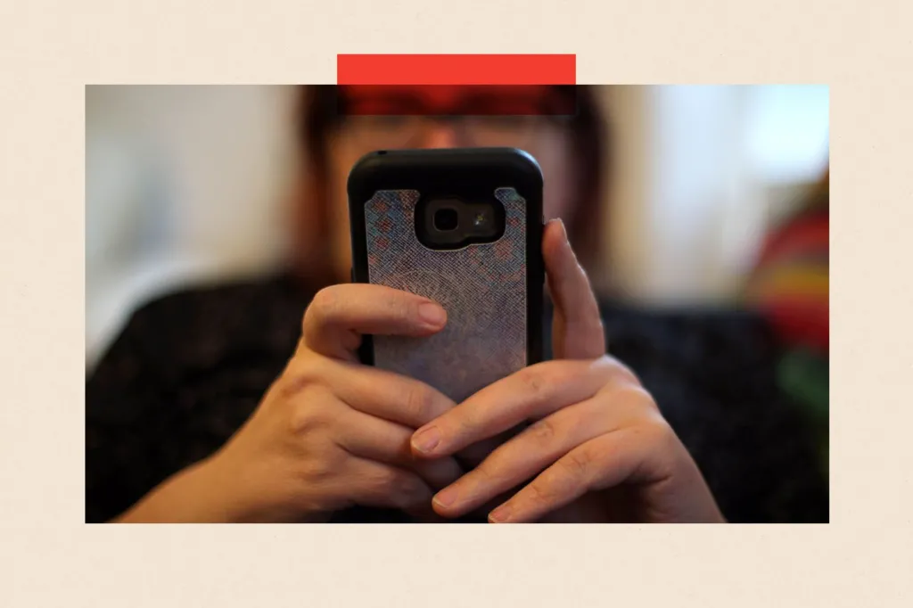 A woman uses her mobile phone