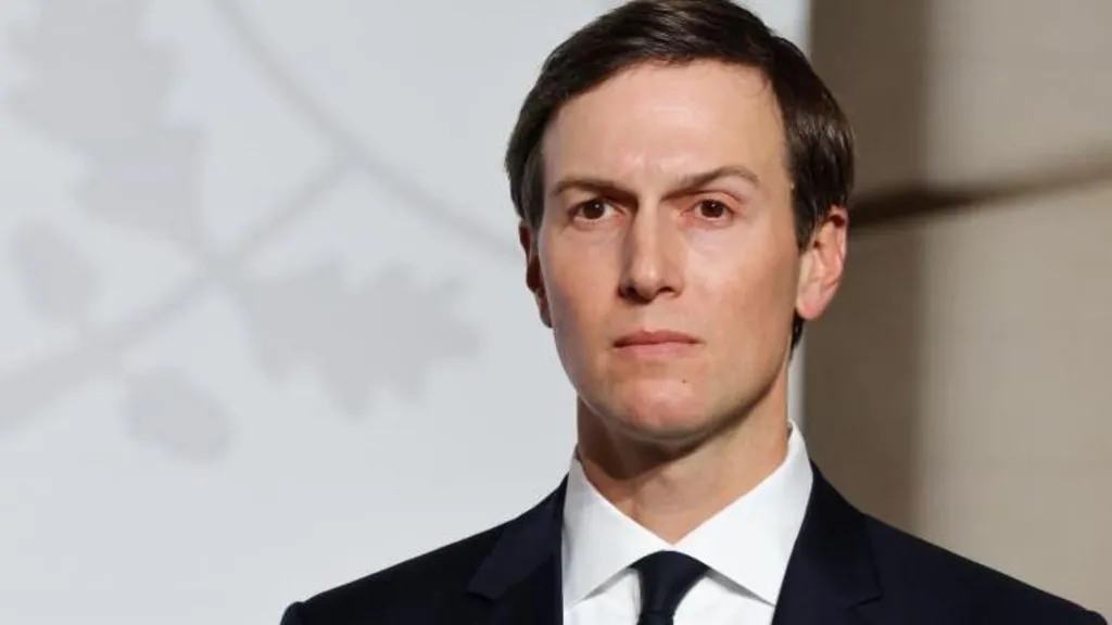 An image of Jared Kushner dressed in a black suit with a white shirt staring off into the distance.