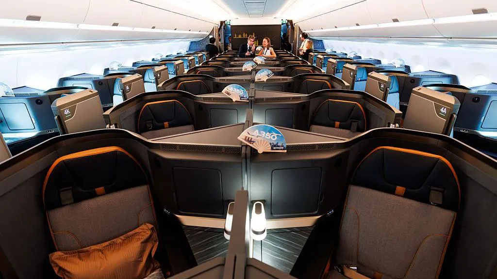 Business class seats onboard an Airbus SE A350-1000 aircraft operated by Starlux Airlines Co. during the Singapore Airshow in Singapore