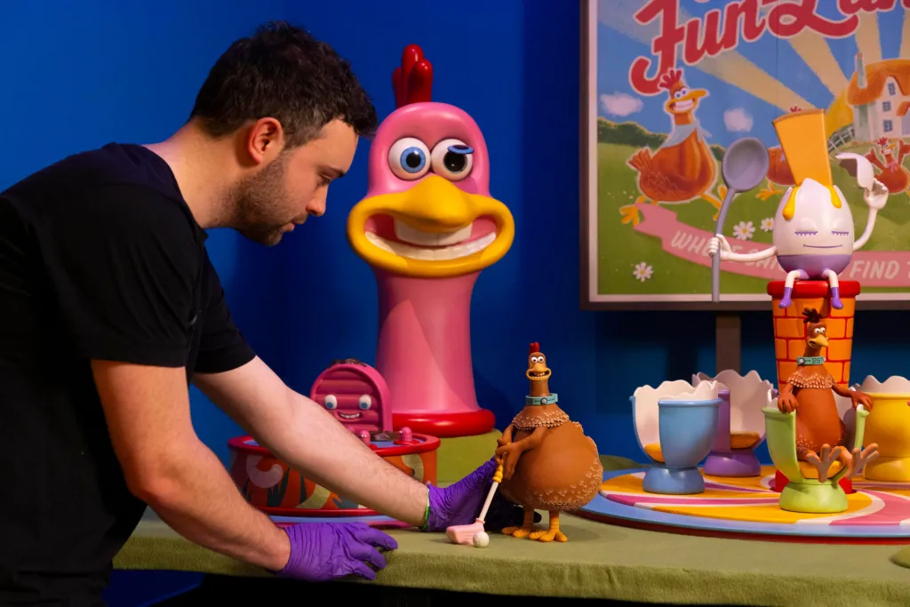 A man setting up a Chicken Run installation 