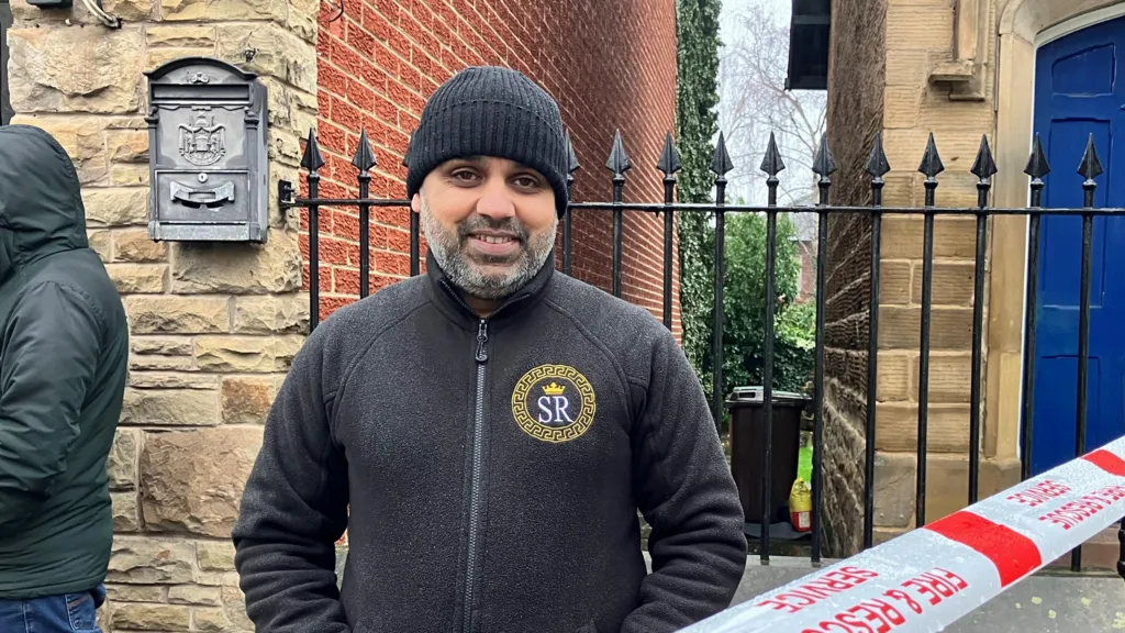 Habib Akhtar, who is wearing a black beanie hat and a black zip-up jumper.