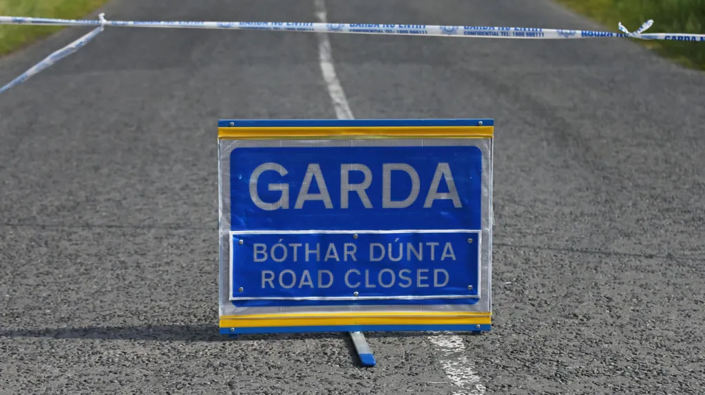 A blue Garda road closed sign.