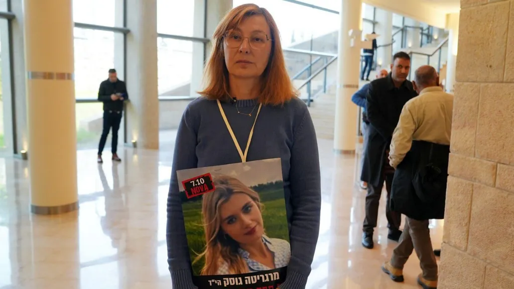 Dr Valentina Gusak holds a picture of her daughter in the Knesset. Her daughter was killed by Hamas on 7 October 2023