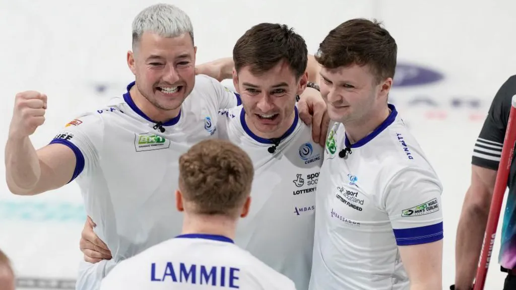 Scotland's Hammy McMillan celebrates with Bobby Lammie, Grant Hardie and Bruce Mouat after winning the semi final match against Canada in the World Men's Curling Championship