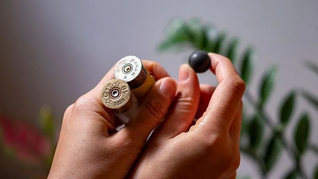 A woman shows spent shotgun rounds and a rubber pellet reportedly collected during the protests on 8 January 2026 in Tehran, Iran  (21 January 2026)
