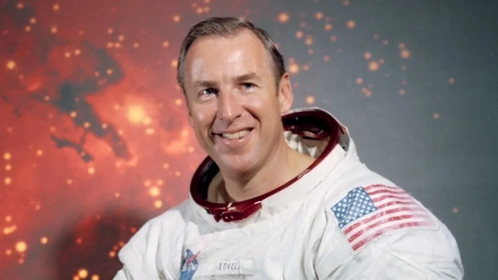James Lovell is photographed wearing his astronaut suit albeit without his helmet.