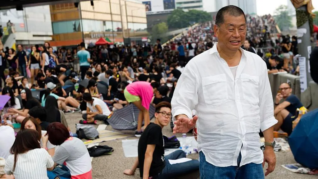 Lai stands in the crowd taking part in a sit-in called 'Occupy Central' or 'Umbrella revolution' in Connaught road, Admirality, Hong Kong, on October 2, 2014. 